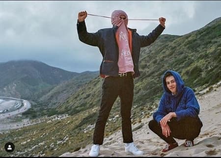 Griffin Gluck and his friend at the top of the hill promoting a clothing brand via his Instagram